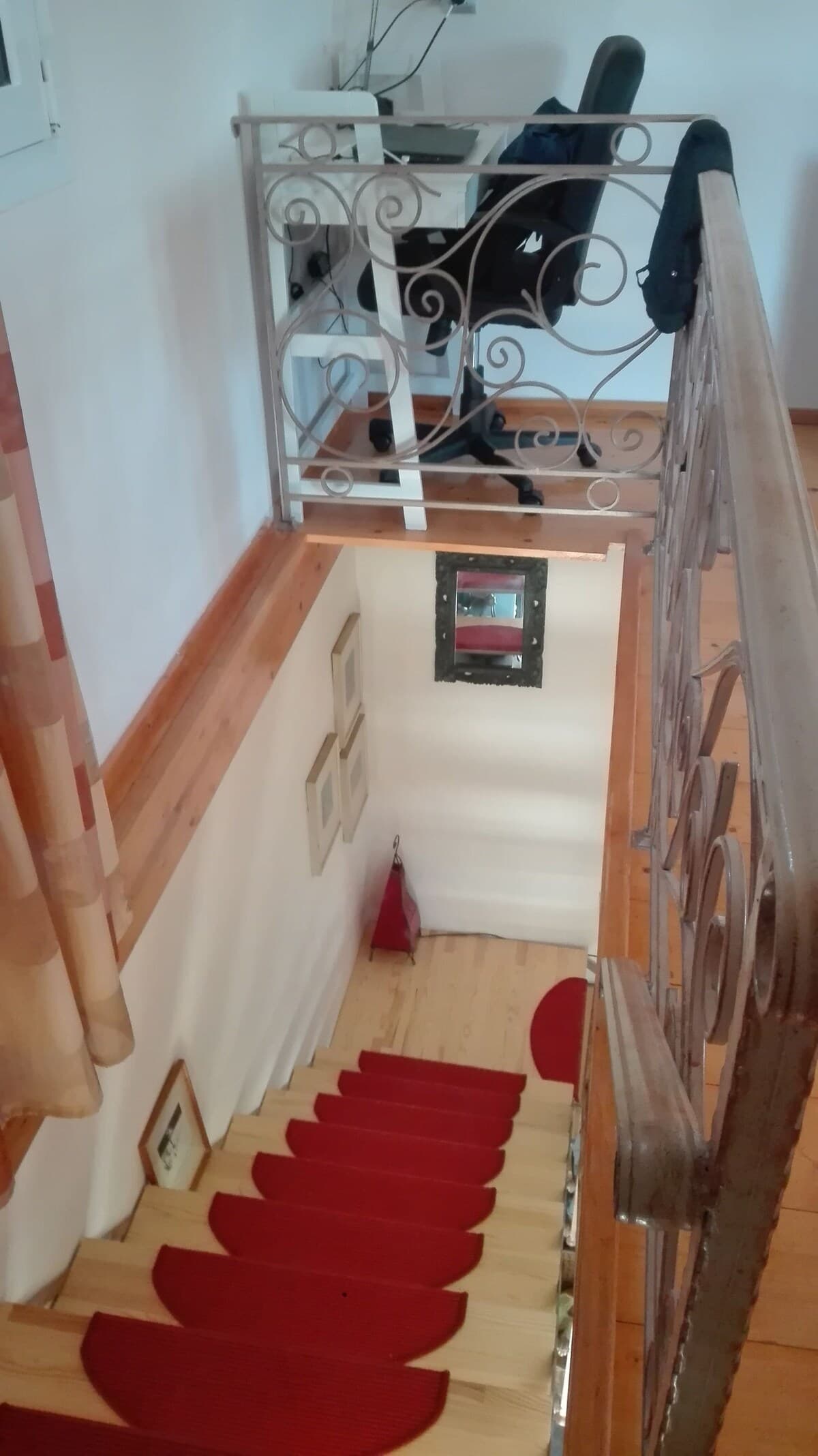 Interior staircase with wrought iron railing